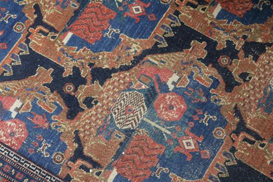 A Persian blue ground carpet, woven with stylised shrubs 260 x 170cm